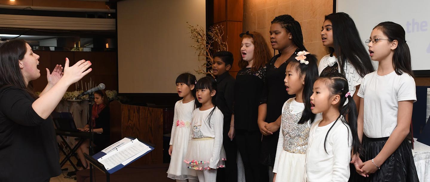 Children singing at Flushing YMCA event