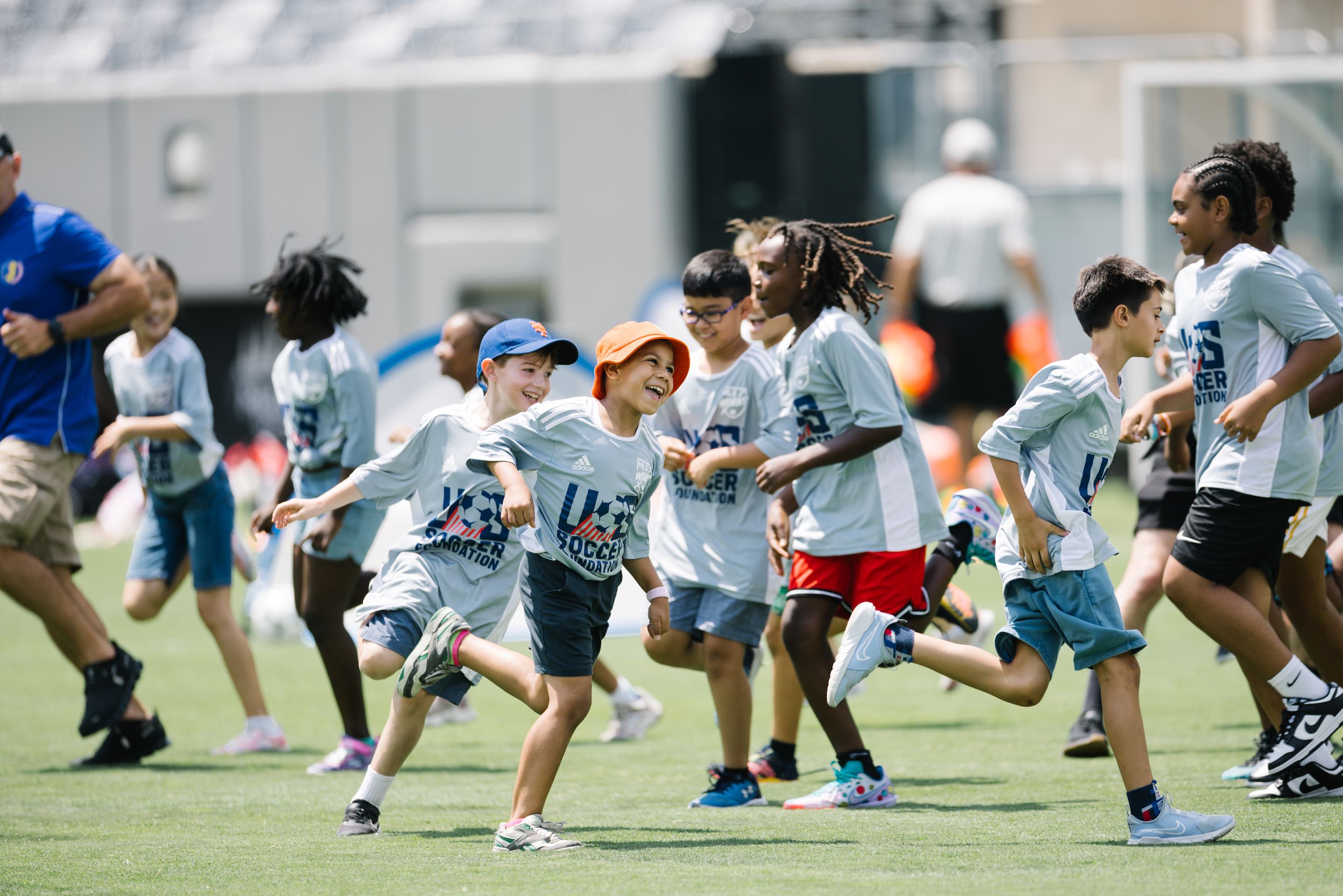 kids play soccer on field