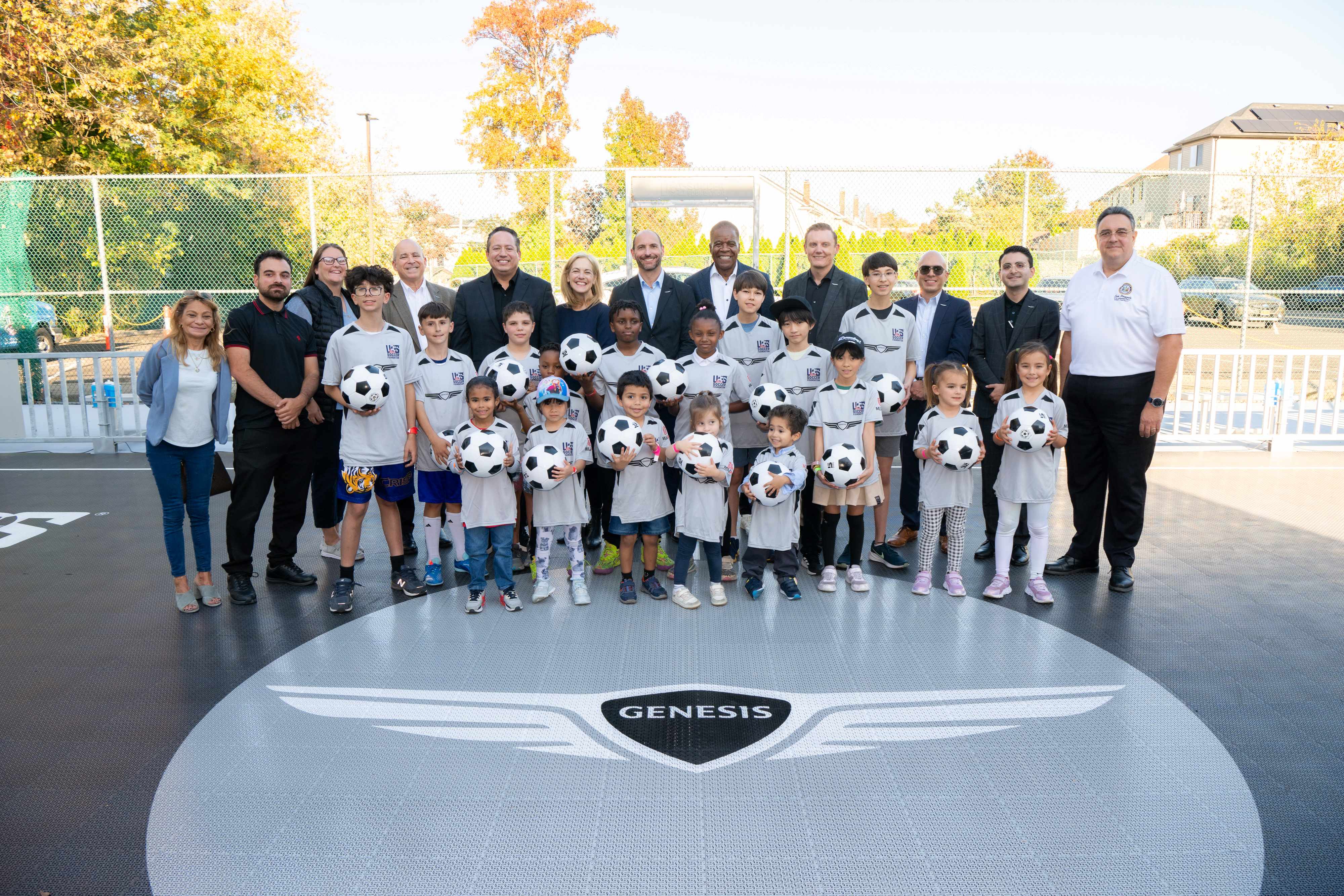 kids holding soccer balls at Broadway