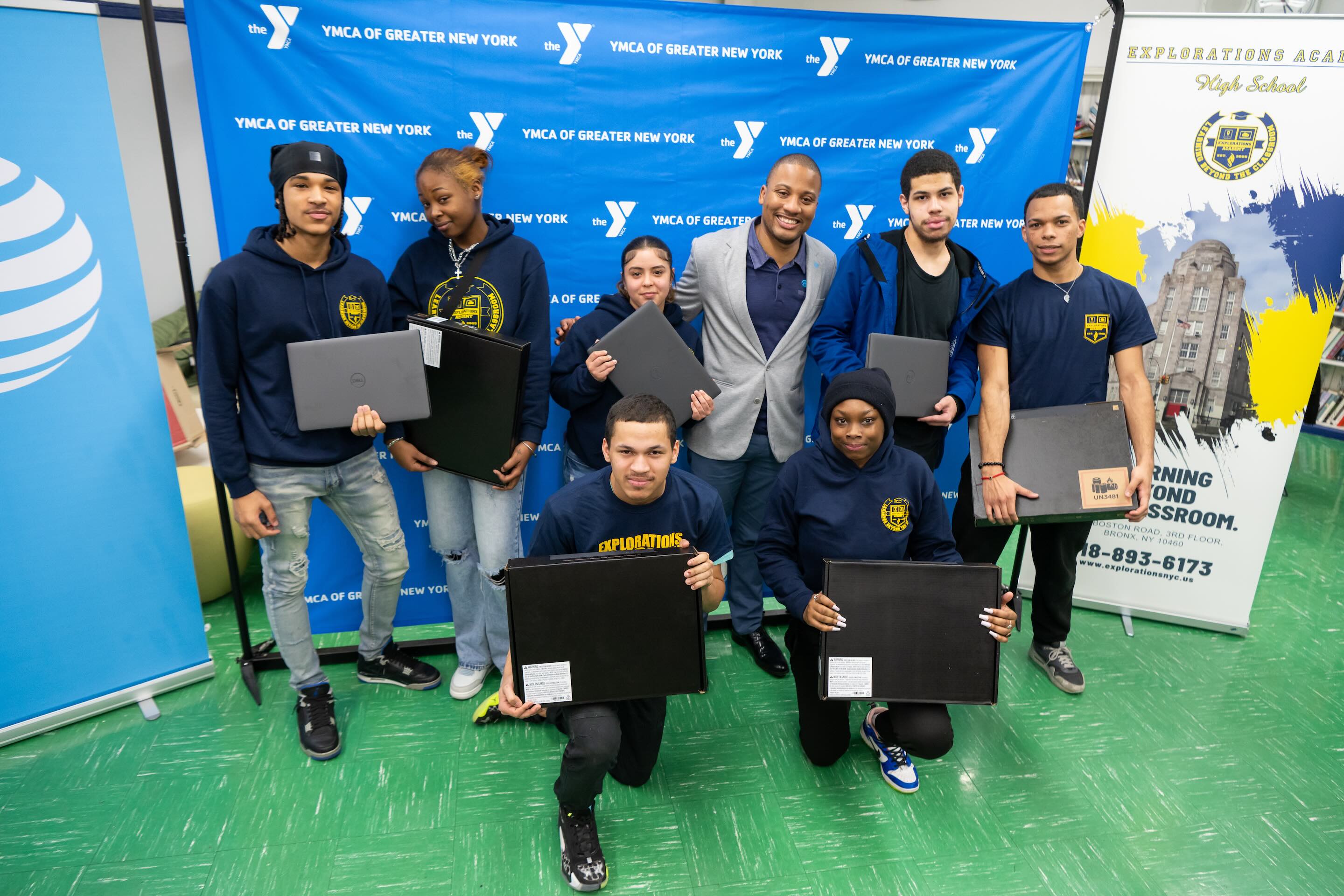 Group holding laptops