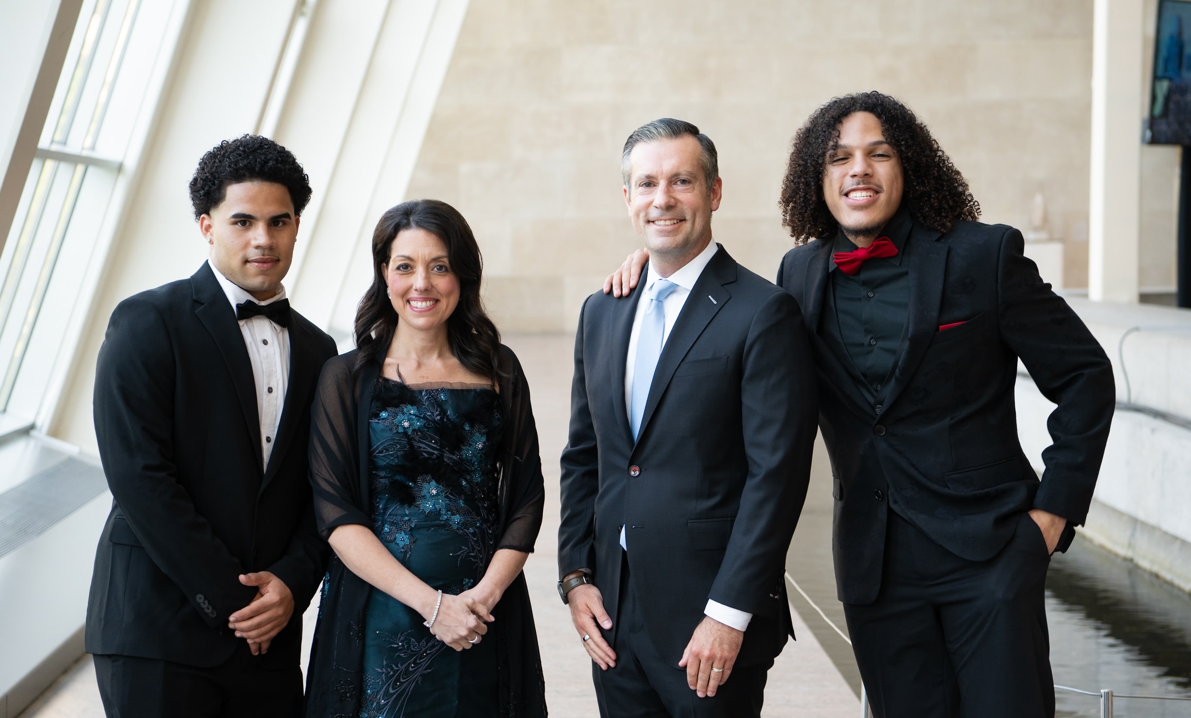 4 people stand inside met museum