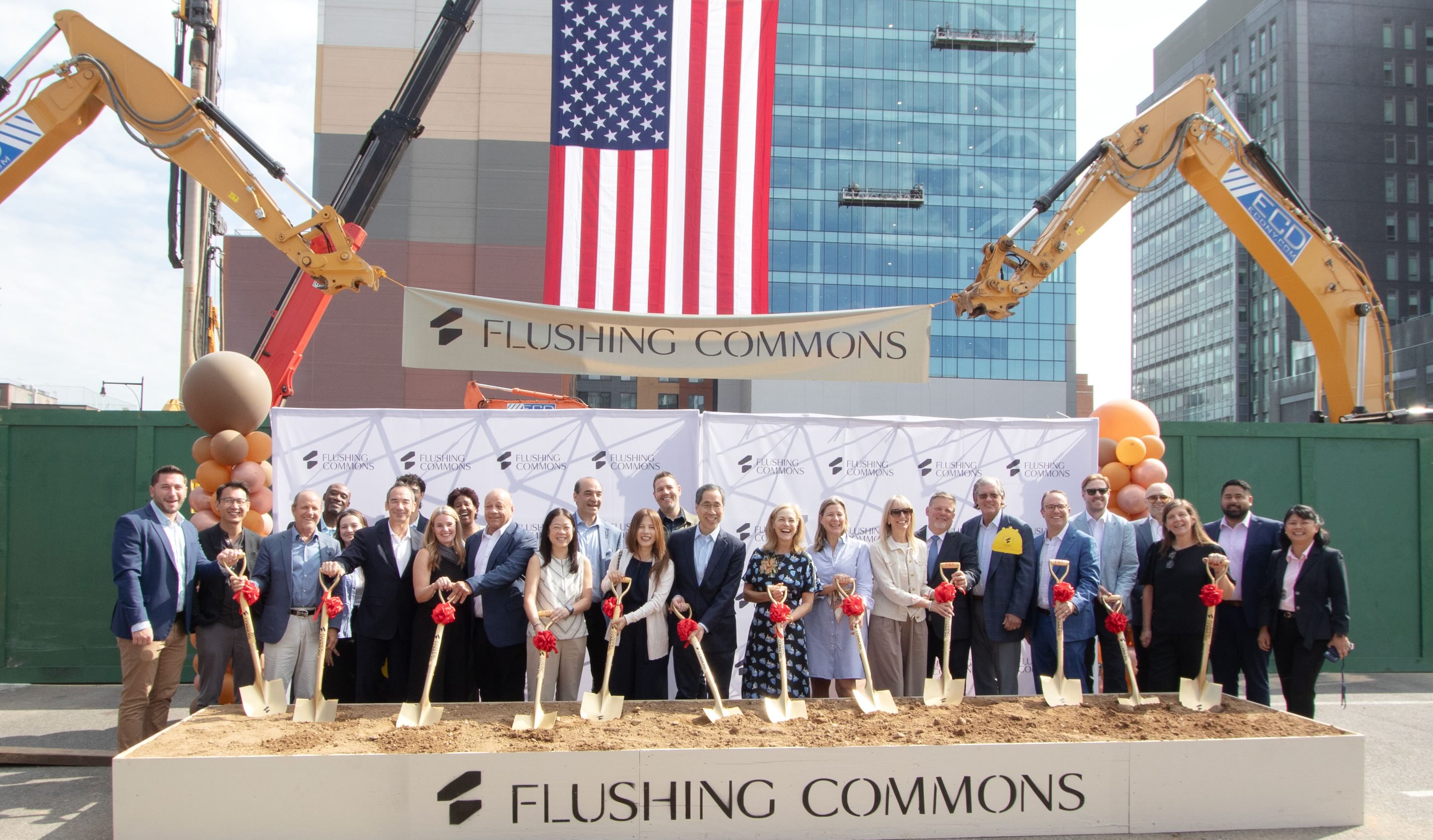 Group photo with shovels at construction site