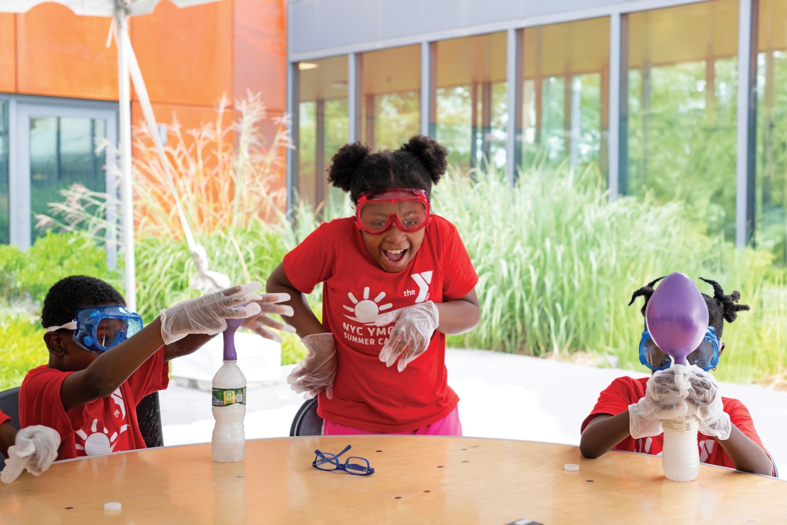 3 kids doing science projects
