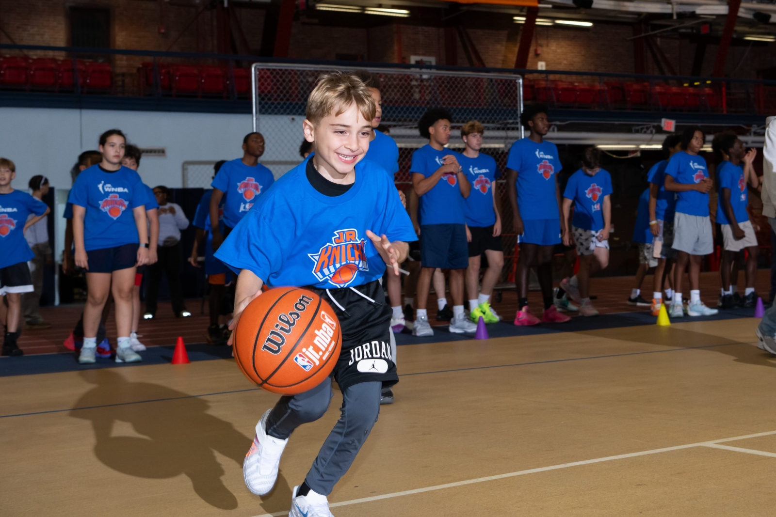 kid dribbling basketball