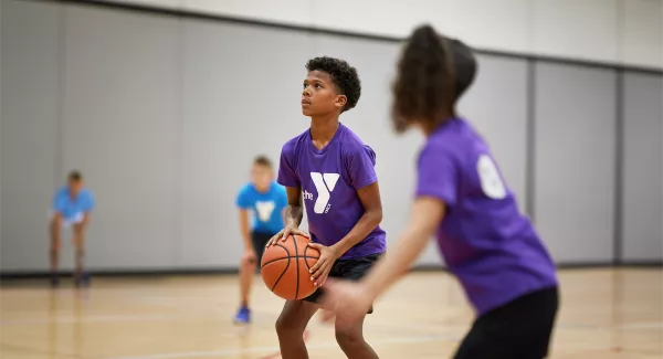 kid holding basketball