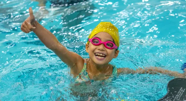 kid smiling in pool