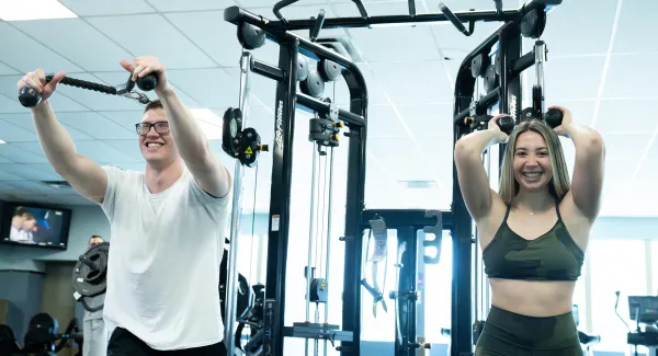 couple working out on fitness machines