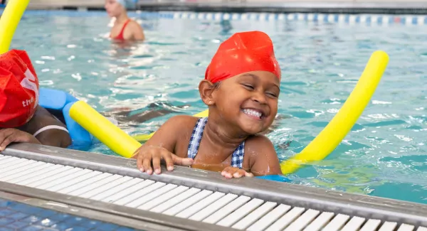 girl smiling in pool