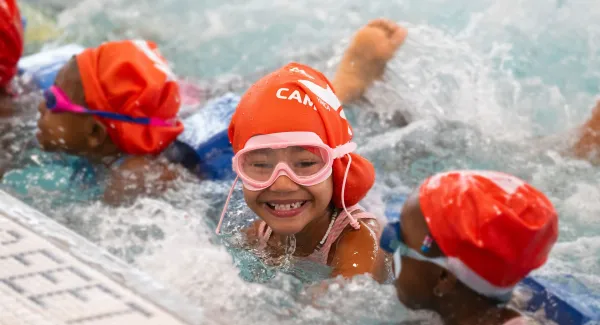 girl smiling in pool