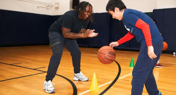 basketball kid and instructor