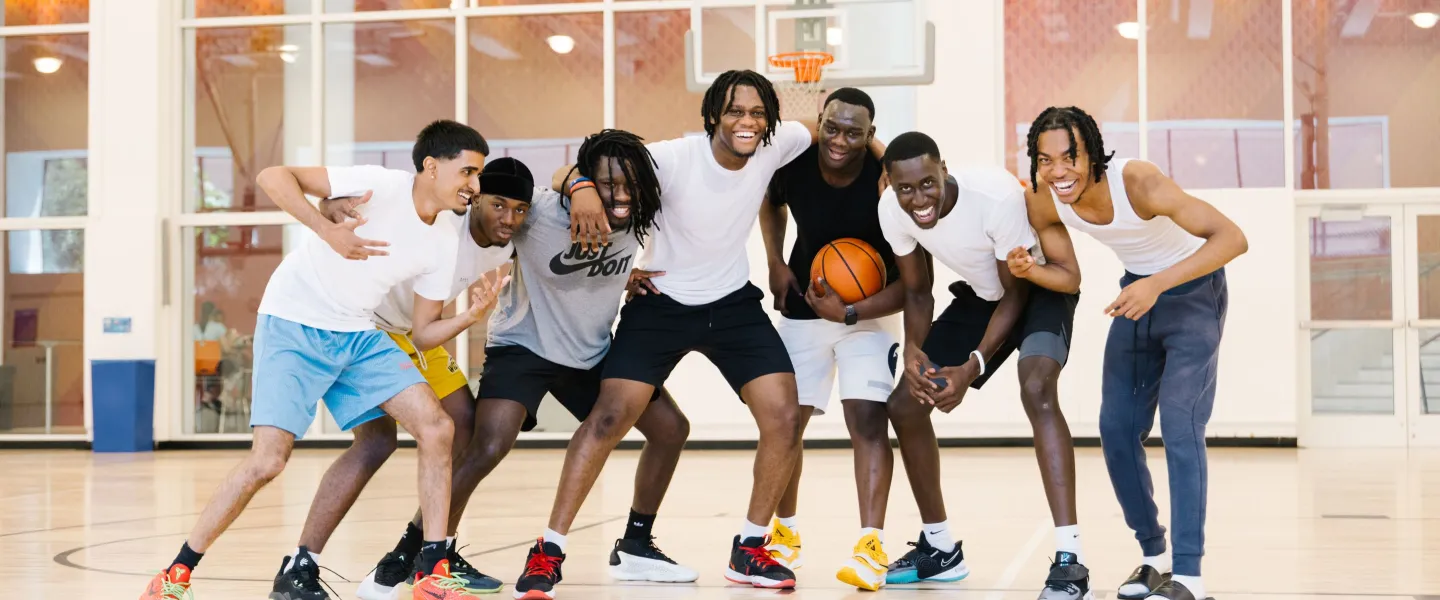 group photo of guys on basketball court