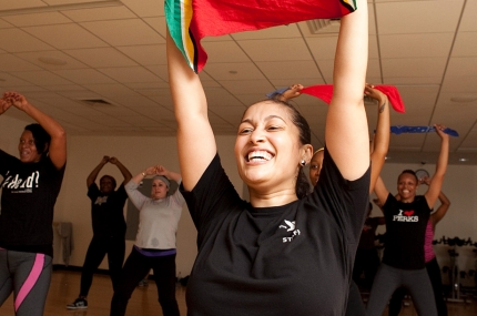 Instructor teaching group fitness and exercise at YMCA