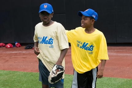Kids playing baseball during youth sports class at the YMCA