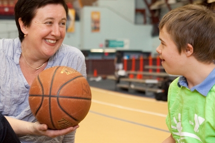 Family plays basketball during free recreation time at the Park Slope Armory YMCA