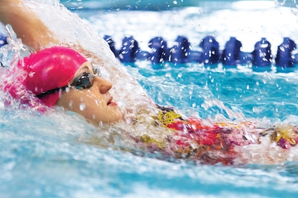 Swimmer practicing in pool