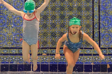 Kids swimming for birthday pool party at the YMCA