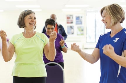 A YMCA personal trainer works with a small group.