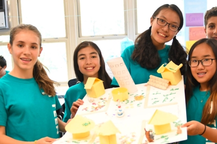 Teens show off a project at the McBurney YMCA summer teen camp.