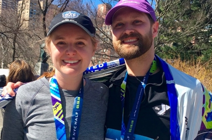 A couple finishes the NYC half marathon as part of Team YMCA.