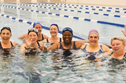 A group of swimmers in a water exercise class at the Y.