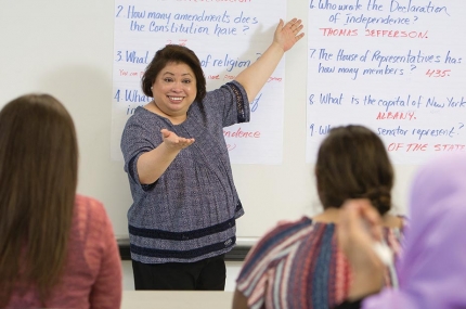 A New Americans Welcome Center instructor teaches a class to immigrants.