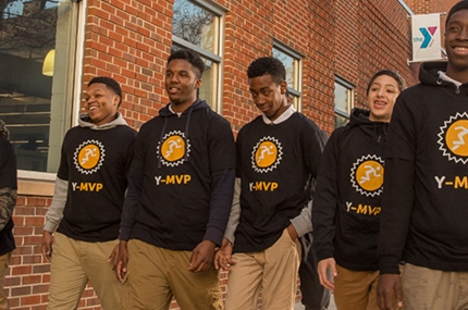 A group of teens wearing Y tee shirts.