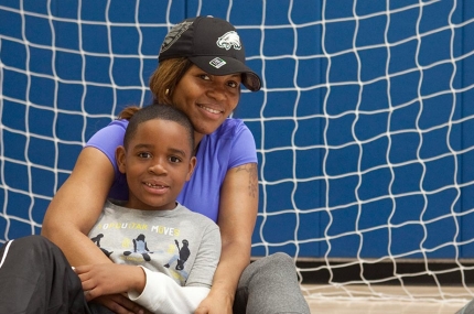 Mother and son in gymnasium at YMCA
