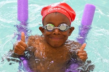 Summer campers swimming at YMCA