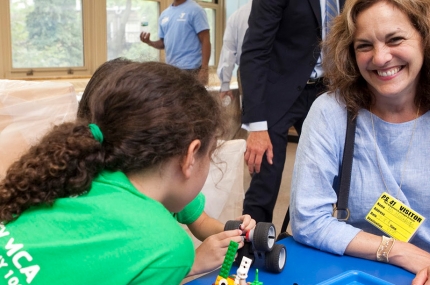 Sharon Greenberger with summer camper at robotics camp