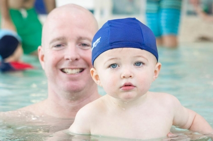 Dad and baby swim at YMCA