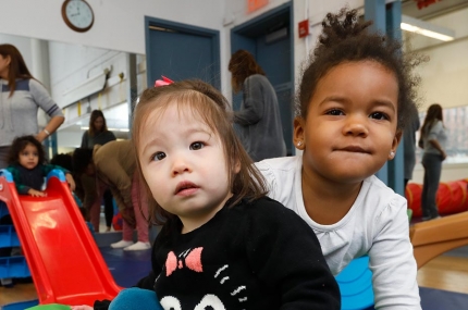 Two babies playing inside YMCA