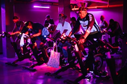 Blacklight Spin cycling class in Brooklyn YMCA studio