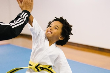 Karate kid gives coach high five