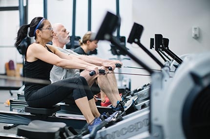 Fitness class using row machines