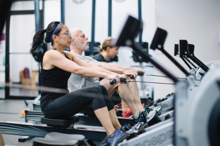 Fitness class using row machines