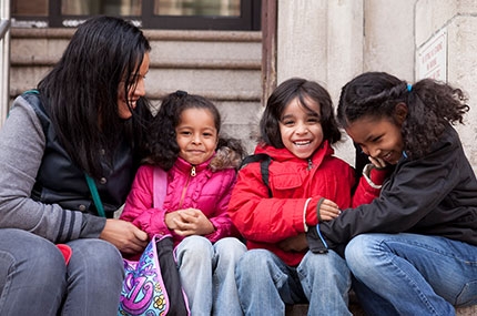 Mom with kids outside the YMCA