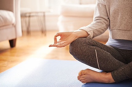 Woman meditating at home