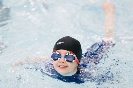 kid swimming in pool