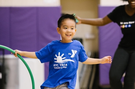 boy running in gym