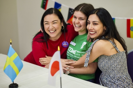Three friends at a new immigrants event