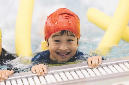 boy smiles in pool