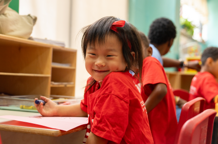 Smiling child at Y inclusion summer day camp