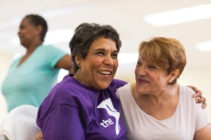 two women sharing a happy embrace
