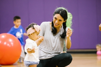 woman in gym with child
