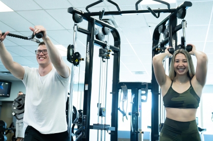 couple working out on fitness machines