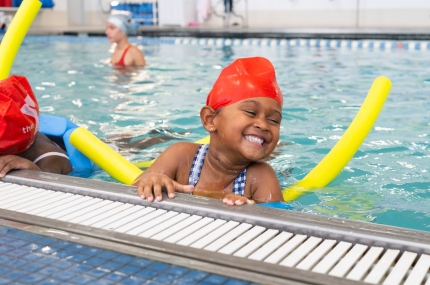 girl smiling in pool