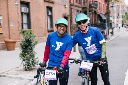 Two riders pose at 2024 Bike Tour.