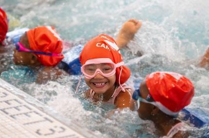girl smiling in pool