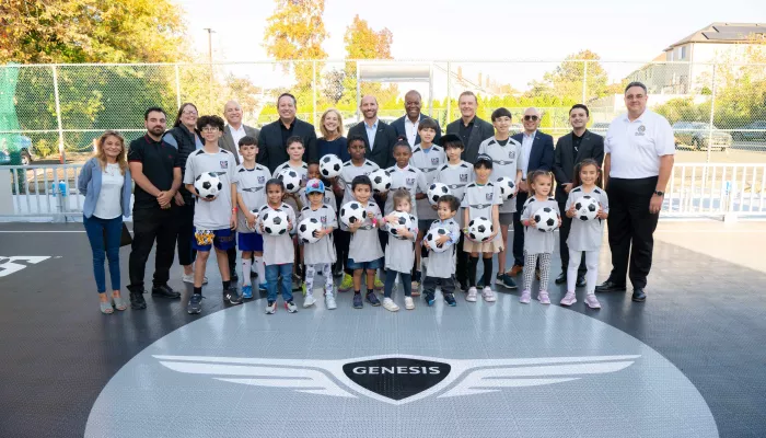 kids holding soccer balls at Broadway