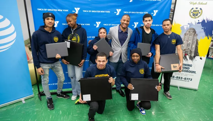 Group holding laptops